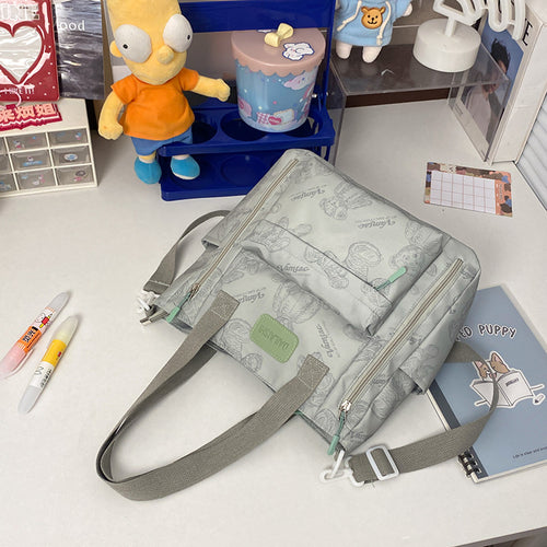 Everyday Bear tote bag shown in all six available colors: beige, black, gray, green, purple, and red