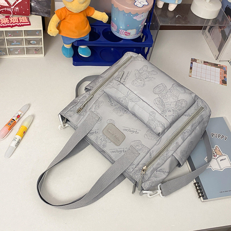 Interior view of the Everyday Bear tote showing the built-in phone pocket and lining