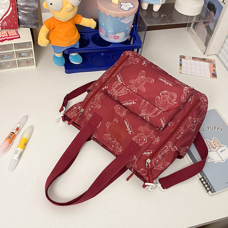 Everyday Bear crossbody tote worn as a shoulder bag for everyday use