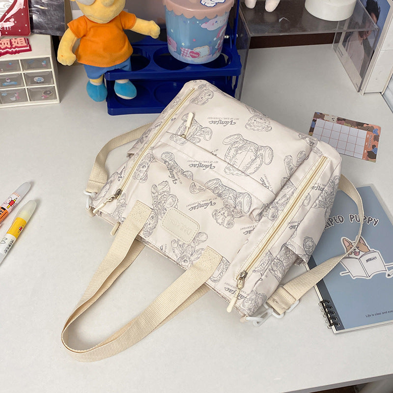 Everyday Bear crossbody tote bag - front view with adjustable strap and zip closure