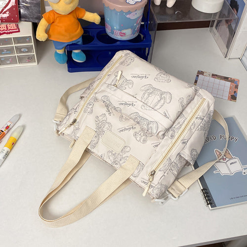 Everyday Bear crossbody tote bag - front view with adjustable strap and zip closure